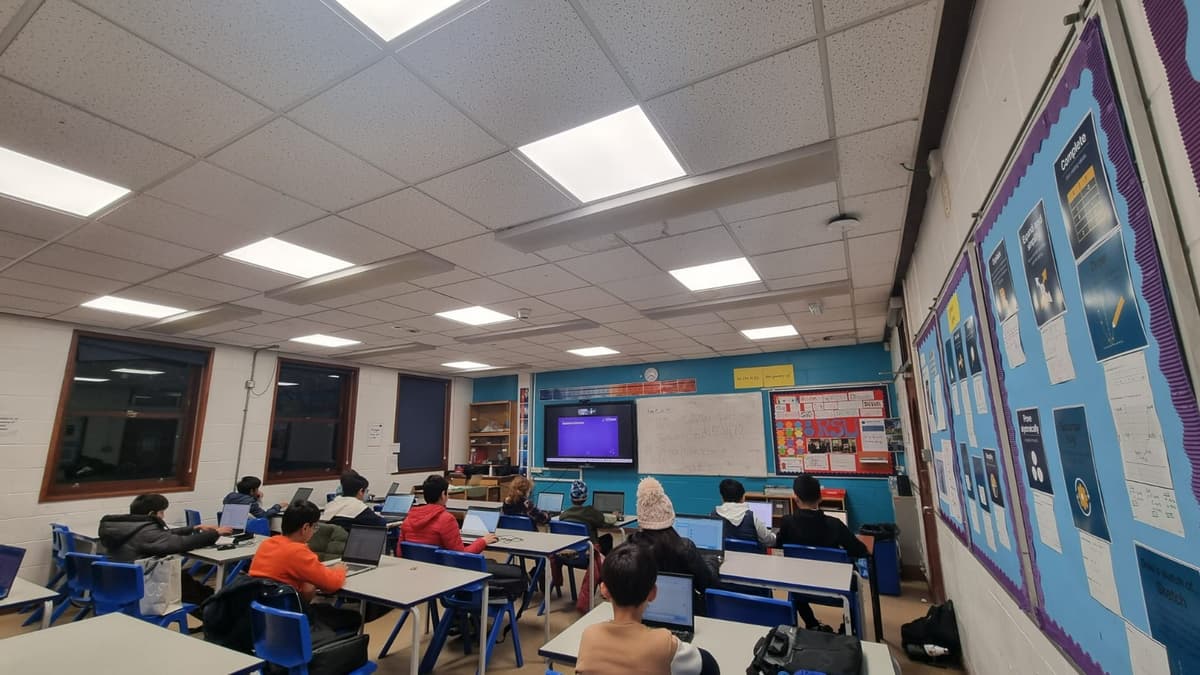 MathShotJr evening workshop with students following along on screen